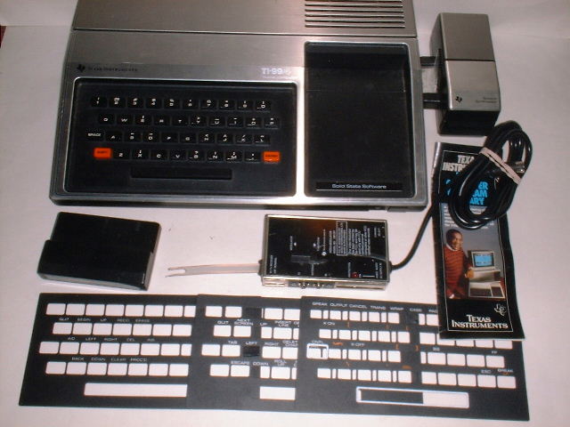 1979_TI-99-4_with_Speech_Synthesizer%2C_RF_modulator%2C_keyboard_overlays.jpg